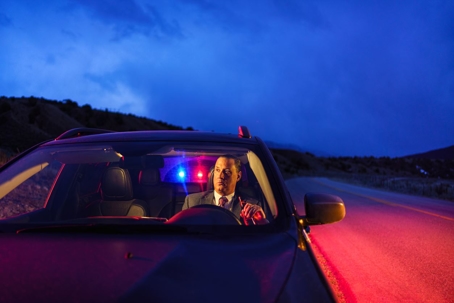 man-in-car-getting-pulled-over-by-police
