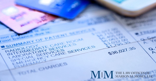 medical bill with credit cards laying on top