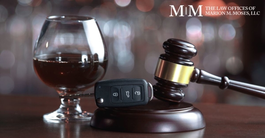 car keys, gavel, and a glass of red wine